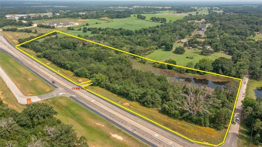 Located directly across the loop from UT Health Systems Hospital.  Great location for retail or office development. 15.48 acres with a tranquil pond. 

Exact location of City water and sewer must be determined. This tract has been resurveyed to include more acreage.  The appraisal district map reflects the original 12.34 acre tract.