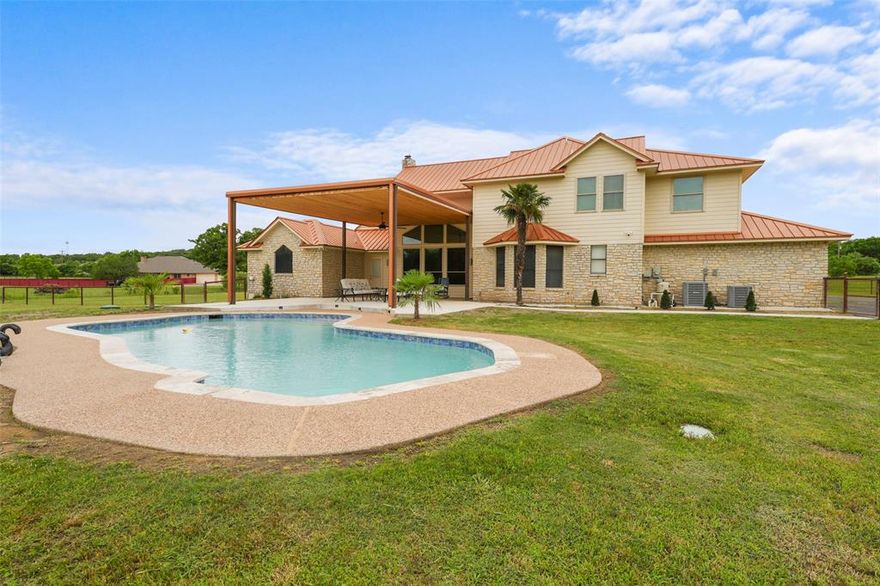 This beautiful home has it all! 2.38 acres, a pool, 2 stories, LARGE WORKSHOP, perfect location and amazing features inside! Kitchen comes with a Built-in Wine Cooler, Granite Countertops, Stainless steel appliances, and Dry and Wet Bar. Its open floor plan, vaulted ceilings, and walk in closets add to this homes' aesthetics and comfort. Not to mention, The covered porch and pool in the backyard are perfect for entertaining! The workshop comes with electric, water, and a half bath! It measure 40x82 and can be easily personalized to fit your needs! Don't miss out on this wonderful opportunity!