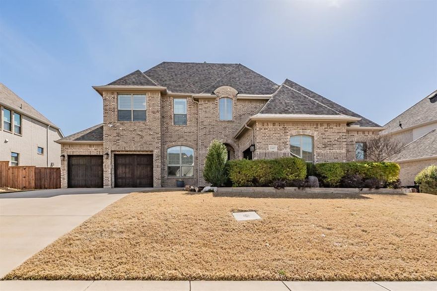 Welcome to 11609 Little Elm Creek Road in Canyon Falls – Argyle ISD! Built by Drees Homes, this exquisite 3,980 sq ft north-facing home features 4 bedrooms, 4 baths, a study, game room, media room, and 3 car garage. The grand entry showcases a breathtaking spiral staircase and beautiful flooring throughout the main living areas. The study is situated off the entry. The living room, kitchen, and dining area flow seamlessly in an open-concept layout. The living room features a stunning Heatilator fireplace, while the kitchen boasts a large island, gorgeous countertops, abundant cabinetry, and 2 pull-out spice racks. The dining area easily accommodates an oversized table. A desk area and walk-in pantry are just off the kitchen. Tucked away at the back of the home, the primary suite offers a spa-inspired bath with a walk-in shower, soaking tub, and spacious closet that connects to the laundry room with a sink. The kitchen pantry, primary closet, and laundry room include custom Elfa shelving for incredible organization. A secondary bedroom and full bath are located downstairs. The home continues to impress upstairs with a beautiful game room, a private media room, a secondary primary suite, and an additional bedroom with a full bath that also opens to the hallway. The backyard is perfectly positioned to enjoy breathtaking year-round sunsets. The backyard features a pool and spa with a bubbler and 3 water features, controlled via an app. Other backyard highlights include a covered patio, pergola, and private putting green. Canyon Falls HOA includes 2 resort-style pools, clubhouse with fitness center, playgrounds, splash pad, dog park, and miles of trails, plus front yard lawn maintenance, TV, and internet service. This home is located in the lowest property tax rate in Canyon Falls and zoned to highly rated Argyle ISD, with Argyle South Elementary and Argyle High School within walking distance. Schedule your showing today to experience the ultimate in luxury living!