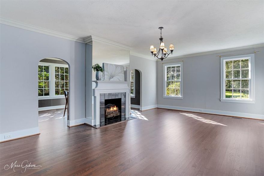 Welcome to a moment in time when craftsmanship, character, and timeless elegance define this stately Glenwood home, built in the 1940s. From the moment you arrive, the home’s commanding presence is undeniable—graceful symmetry, classic architectural details, and a sense of history that immediately sets it apart. Inside, original charm blends seamlessly with thoughtful updates designed for modern living. The remodeled chef’s kitchen is a standout, featuring a Wolf gas range, expansive countertops, abundant storage, and a layout ideal for both everyday cooking and entertaining. Two dining areas provide flexibility for intimate dinners or larger gatherings. At the same time, two spacious living rooms—each with a fireplace, hardwood floors, ceramic tile, and original light fixtures—offer warmth, flow, and timeless appeal. An additional entertainment room with a bar provides extra space to host, relax, or celebrate. Upstairs, you’ll find three well-appointed bedrooms, two full baths, and a generous flex space that can adapt to your lifestyle—perfect for a home office, library, workout room, playroom, or guest retreat. Step out onto the private deck for morning coffee or evening unwinding. The thoughtfully designed back addition by Weiner complements the original architecture while enhancing livability and comfort. Special details like large swing doors, an original safe, and vintage elements honor the home’s history, while updates ensure efficiency and convenience for today. This is more than a home—it’s a living piece of Glenwood history, offering timeless beauty, remarkable space, and endless flexibility in one of the area’s most iconic settings.