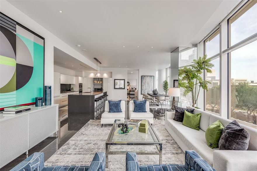 Located in the heart of the Dallas Arts District, Museum Tower stands as Dallas’ premier high-rise residence, surrounded by world-class performance halls, museums, acclaimed restaurants, luxury hotels, and the iconic Klyde Warren Park. This exclusive tower offers a vibrant social community with unparalleled amenities and elevated services, including two house cars, 24-hour valet, doorman and concierge services, weekly resident happy hour, a state-of-the-art fitness center, conference room, two owner lounges, two guest suites, dog park, an 80-foot heated pool and spa, fire pit, and outdoor grilling areas.
A private elevator delivers you directly into your residence, opening to a gracious entry foyer and expansive living area adorned with polished Porcelanosa Italian 4’ x 4’ porcelain tile floors. The home features smooth museum-finish walls, soaring 10-foot ceilings, and motorized shades throughout, creating a refined yet comfortable living environment. The chef’s kitchen is equipped with premium Miele appliances, a gas cooktop with exterior-vented hood, quartz countertops, and exceptional custom cabinetry.

A recent remodel enhances the residence with new flooring throughout, bespoke cabinetry in the den-office, primary bath, dressing room, and kitchen, along with a striking custom Estiluz designer light fixture that elevates the kitchen as a true centerpiece. This sophisticated home offers luxury, convenience, and cultural immersion at one of Dallas’ most prestigious addresses.