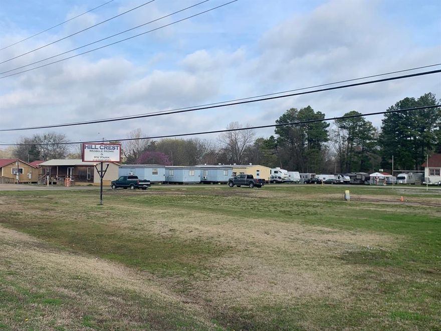 Location, location, location. 14 acres with amazing road frontage. Amazing investment opportunity in Haughton! Hillcrest RV and Mobile Home park with room to grow and increase revenue. Currently 60 rentable lots with potential for an additional 30 approximately. Currently monthly rentals. New owner could change to daily, weekly and monthly rates.  Property has its own septic and community well. There is a workshop and an office. 14.1 acres. Few of the older trailers will be removed and not part of sale.
