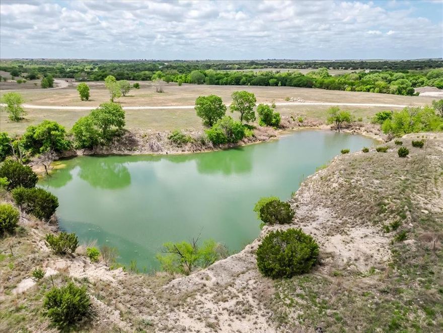 Everyone knows the three most important things in real estate are location, location, location—and here it is. Just minutes from I-20 and downtown Weatherford, this remarkable 396-acre tract offers a rare opportunity to own a legacy piece in the heart of Parker County. With four large water features, scenic Sanchez Creek frontage, and a beautiful mix of scattered hardwoods, the land delivers both natural beauty and functionality. The varied terrain creates depth and character, offering elevated views, privacy, and endless possibilities. Whether you envision a premier ranch, recreational retreat, or a long-term investment, this property has the potential to become one of the most stunning ranches in the area. For those looking at future development, the extensive road frontage on Bethel Road provides strong accessibility and flexibility for subdivision or planned development. If considering a commercial or mixed-use development, a turn lane is already in place, adding valuable infrastructure and ease of access. Water is a standout feature, with two high-producing wells already in place—one producing approximately 20 gallons per minute and the other an impressive 60 gallons per minute—supporting both residential and agricultural use. Properties of this size, location, and versatility are rare. This is Parker County land at its finest.