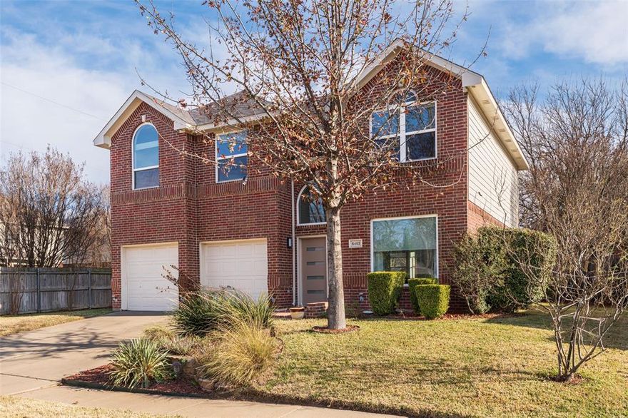 Knockout SW Arlington has had massive updating! The heart of the home is the stunning kitchen, thoughtfully designed with sleek grey gloss cabinets, striking white quartz countertops, a waterfall island with a built-in drawer microwave, & a modern stainless steel range wall vent, & Bosch dishwasher. Designer window treatments complement the home’s décor and color scheme, while remote-controlled shades on large windows add convenience & elegance. The inviting family room offers the perfect gathering space, featuring a cozy fireplace & abundant natural light. Show-stopping bathrooms that boast a glass tile accent wall with a cascading waterfall feature in the secondary full bath & a floating vanity in the half bath that exude modern style. Upstairs, the serene primary bedroom provides a private retreat with an ensuite bath, while the spacious secondary bedrooms share a well-appointed bath, offering comfort & flexibility for guests. Enjoy a Texas-sized backyard framed by mature trees, complete with a patio that’s ideal for relaxing or entertaining.  In the last 5 years, sellers have installed a Class 4 Roof, large format grey ceramic floor tile in the kitchen & living area. New grey carpet upstairs & in the room off the kitchen. Simonton Windows-front & side of house, excluding bathroom side window. Recently painted interior and exterior & horizontal lite front door. New 200-AMP electric panel installed & whole house surge protection installed. An electric tankless water heater has been added. New ceramic spa floor tile in the master bath toilet room. Builder added plywood to the walls of the downstairs half bathroom to reduce noise & reinforce for storm protection. Easy to maintain front yard designer landscaping with retaining wall, native plants, mature trees, including crepe myrtle trees lining the 6 ft wood fence, Elaeagnus shrubs surrounded by contrasting red mulch, & well-maintained lawn. Wood, Boles, & Martin school district. Full list of upgrades is available.