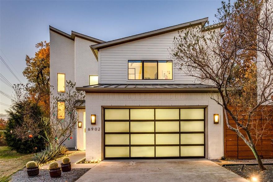 Incredible 2016 contemporary build boasting over 3100 square feet of open living overlooking incredible creek lot will make you feel like you are living in the country on a quiet Lakewood enclave! This well-laid out design plan offers three bedrooms,  a second living area, and utility upstairs and a fourth bedroom-office downstairs.  The kitchen is complete with an oversized island, amazing wine display, double ovens, wet-bar, and abundant well laid out cabinetry which opens to the family-living and overlooks the creek. The living area is complete with banks of light filling windows, triple atrium sliding doors, hardwood flooring, and designer touches. The open light and bright design finishes throughout this home are immense. Additional amenities include fenced yard, outside living area with custom lighting, fire-pit, carefree turf lawn, and award winning Lakewood elementary.