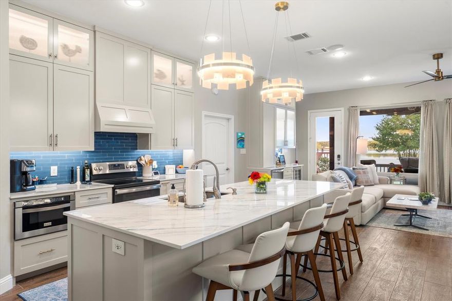 Move in ready watefront home on open water in the coveted gated Park Harbor neighborhood, Cedar Creek Lake!  Enjoy open water views and breezes from this pristine, updated waterfront home.  Wonderful covered back porch and large fenced yard is perfect for the entire family, friends and pet.  The main level features a spacious great room with an open floor plan and lake views, along with the primary suite on the lakeside. Upstairs offers a second living area, three bedrooms, and two full baths, providing space for family and guests.  Outdoor living includes a covered deck, a large lawn with fire pit, and a boathouse with boat and PWC lifts, storage, touchless boat cover, and a party deck on top.  Additional highlights: Large upstairs living space, oversized utility room with sink and storage, cocktail bar with wine fridge, outdoor shower, sprinkler system, low-maintenance concrete plank siding, garage with 220 amp service and extra storage, and steel retaining wall replaced in 2022.  This property combines thoughtful updates with excellent water access, making it ideal for both full-time living and lake getaways.