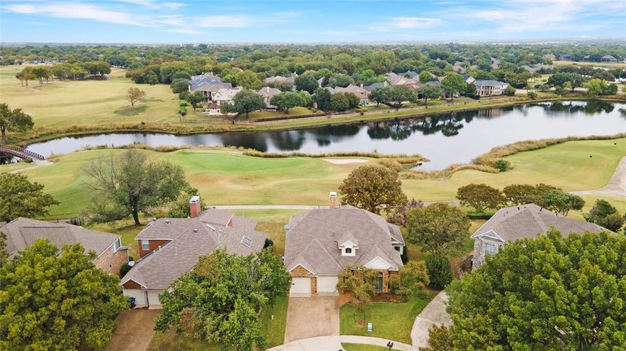Jaw-Dropping Golf Course Views in the Heart of Stonebridge! Seller is offering $5,000 to buy down the interest rate or towards buyer closing costs! This Briar Ridge beauty backs directly to the 8th hole of Stonebridge Golf Club, offering panoramic golf course and lake views from every bedroom you’ll fall in love with every single evening. With nearly $25K in stylish updates, this home blends elegance, comfort, and an unbeatable location in one irresistible package. Step inside to be greeted by soaring ceilings, abundant natural light, and a sun-drenched formal living and dining area that set the tone for upscale entertaining. The spacious kitchen shines with all-new appliances, gorgeous updated flooring, and abundant oak cabinetry. It flows seamlessly into the inviting family room, complete with a cozy brick fireplace and custom built-ins—perfect for relaxed gatherings or quiet nights in. A unique architectural staircase makes a stunning statement as you move through the home, adding both character and charm. Your private first-floor primary suite is a peaceful retreat, featuring a beautifully updated ensuite bath with dual vanities, a soaking tub, and a walk-in shower designed for ultimate relaxation. Upstairs, you’ll find a versatile game room and two generously sized bedrooms—each with serene golf course and lake views that make waking up feel like a getaway. This home offers ample storage with shelving installed in the attic. A new water heater was installed in 2023. Step outside and experience where the magic truly happens—an expansive covered patio overlooking the lush fairways and tranquil lake, ideal for morning coffee or sunset gatherings under the stars. Residents of Stonebridge Ranch enjoy resort-style amenities, including pickleball and tennis courts, scenic trails, lakes for fishing, pools, and the prestigious Stonebridge Golf Course. Located in acclaimed McKinney ISD, this home perfectly blends luxury, lifestyle, and location.