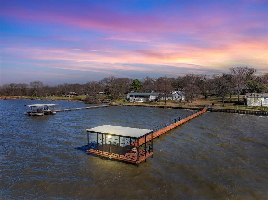 THE PRICE IS RIGHT!!! Discover the fun & excitement of lake life with this spacious 5-bedroom, 3-bathroom home, perfectly designed, turn-key, and ready for R & R. Nestled across the street from the open water of Cedar Creek Lake, this exceptional property offers unobstructed water views, multiple living spaces, & direct access to the lake from the community pier. Don’t worry about someone building and blocking your open water view.The community owns the land and pier directly across the street -- the beauty of lakefront property without the maintenance. Step inside to find a bright and airy main living area with expansive windows, filling the space with light and showcasing beautiful open water views. The home boasts two distinct living areas including the main gathering space and a cozy separate living area, perfect for unwinding year round. The screened-in lakeside porch is the perfect place to enjoy morning coffee or evening sunsets while soaking in the peaceful surroundings.The secluded, screened-in back porch creates a relaxing oasis with a 6-person spa, sitting area, & electric fireplace. A well-appointed kitchen with a large island & ample counter space makes entertaining a breeze.The spacious bedrooms offer comfortable retreats, with the primary bedroom including a private ensuite bath.Outside, enjoy direct access to the water from the community maintained pier, perfect for boating, fishing, or simply relaxing by the shore. The home’s layout and amenities make it an excellent choice for full-time residents or vacation home. It even has electric RV hook-ups and is wired for a full home generator. The community is short-term rental friendly. It's a five minute drive to Cedar Creek Country Club for a boat launch, golf, tennis, swimming, and restaurant. Don’t miss this affordable opportunity to experience lake life! Furnished or not -- buyer's choice!