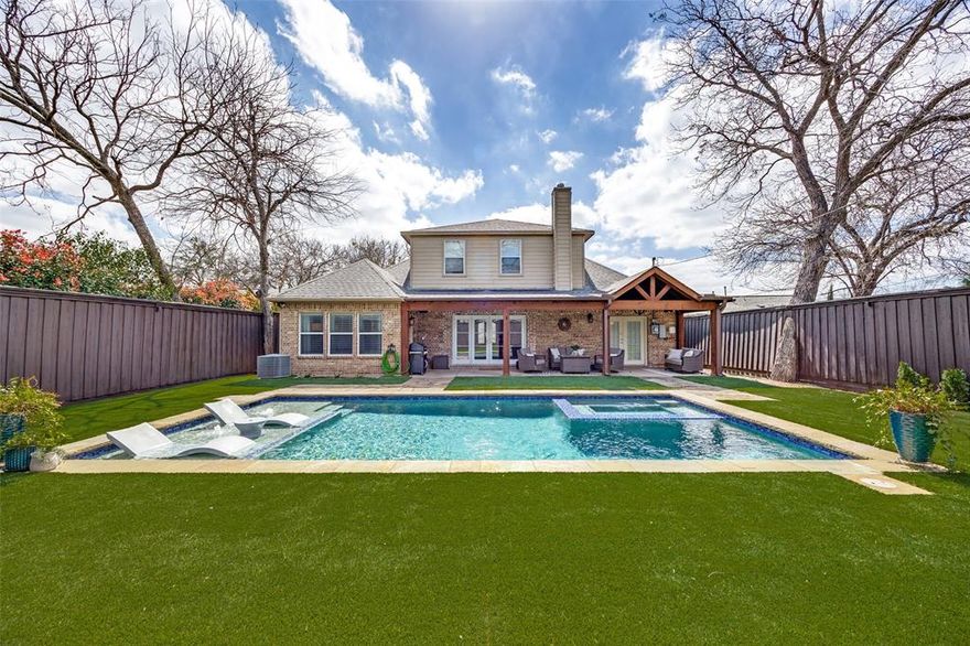 Located in sought after Midway Hollow, this stunning home offers an ideal layout with bright and open living spaces plus a sleek modern pool! You are greeted by the main living area that is surrounded by windows and features hand-scraped wood flooring, high ceilings, and is wide open to the spacious and tastefully updated kitchen. The main living area is anchored by a striking fireplace surrounded by stone, creating a warm and inviting focal point. The kitchen boasts all stainless steel appliances including a gas cooktop and hood, an abundance of counter space, and a cozy dining area that looks out to the fully turfed private backyard, covered patio, and gorgeous rectangular pool and spa. The saltwater pool was constructed in 2021 using gunite reinforced with fiberglass rebar, GFRP, a modern, high-performance alternative to traditional steel reinforcement, offering enhanced durability and corrosion resistance. The downstairs also has a handy half bath as well as a dedicated home office which provides a quiet, functional workspace that can be closed off by French doors. The large primary bedroom features a sophisticated and stylish ensuite bath with a massive walk in closet and separate frameless glass shower. Upstairs, you will find two additional bedrooms that both have walk in closets. This home is just so inviting, and that begins with the lovely landscaping and magnolia bush out front and the interior has been well cared for and simply has an overall charming style. You cannot beat the convenient Midway Hollow neighborhood where you will be surrounded by million dollar plus homes, easy access to Dallas's top private schools, and just around the corner from Central Market!