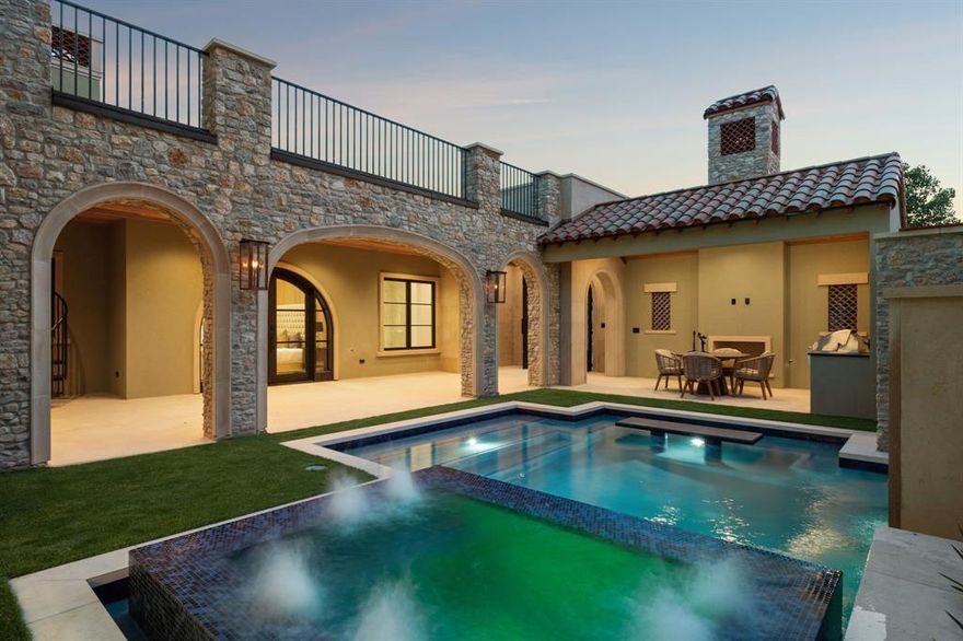 Experience refined living in this exceptional Samuel Osborne custom home, thoughtfully situated in the heart of Westlake Entrada—a European-inspired community. Designed to evoke Old World elegance with the ease of modern luxury, this home features artfully curated interiors set within timeless Spanish architecture. Enter through grand iron gates into a private courtyard, where resort-style amenities await—including a pool, spa, cabana, fireplace, outdoor kitchen, and a spiral staircase that ascends gracefully to a spacious upper balcony. Inside, the home captivates with soaring ceilings, large windows, a custom cast-stone fireplace, and a striking floating staircase—all framed by exquisite designer finishes. Sophisticated elements such as rich wood accents, designer lighting, and a glass-enclosed wine room reflect refined taste and attention to detail. At the heart of the home, the chef's kitchen is a showpiece, featuring a quartzite-wrapped hood, an oversized waterfall island, and premium Wolf and Sub-Zero appliances.  A morning coffee bar flows seamlessly into the owner’s suite, where arched glass doors offer a private escape to the poolside courtyard. The primary bath features a freestanding soaking tub and dual showers enclosed in frameless glass, while the custom boutique-style closet is enhanced with a washer and dryer connection for unparalleled convenience. The main level offers versatility with a home office or game room overlooking the courtyard, as well as an en-suite guest suite with a private balcony. Upstairs, you'll find two additional en-suite bedrooms, a secondary living area, and access to the balcony. An elevator shaft offers future-ready convenience, showcasing thoughtful design throughout. The basement level features a media room or golf simulator and boasts the only four-car garage in Entrada. Located near DFW Airport, Westlake Lifetime Fitness, Southlake Town Square. Zoned to award-winning Carroll ISD and Westlake Academy (an IB World School).