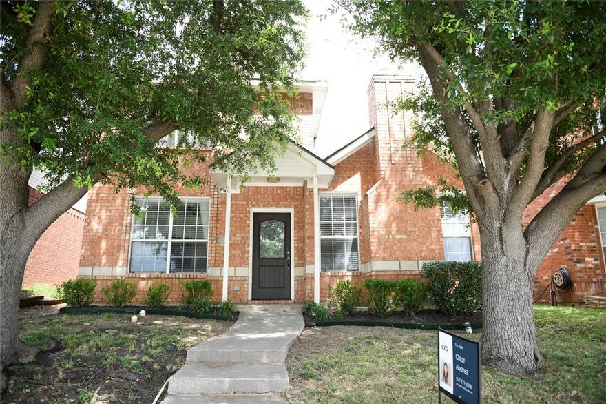 This traditional-style, two-story home in Dallas features a 3-bedroom, 2-bathroom layout across approximately 1,250 square feet. Originally built in 1998 and recently remodeled in 2023, the interior offers an open floor plan with vaulted ceilings, a gas fireplace, and a convenient first-floor primary suite. The property includes practical upgrades like Elfa closet shelving and a large walk-in pantry, while the exterior boasts a 2-car attached garage, a fenced backyard with a flagstone patio, and an automatic sprinkler system.