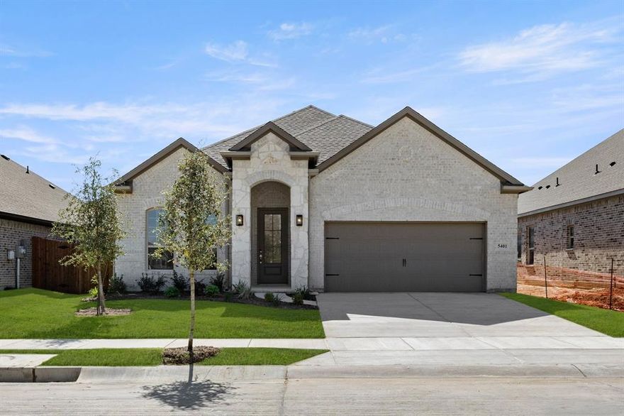 MLS# 21026767 - Built by Sandlin Homes - Ready Now! ~ Welcome to the Brimstone plan, where thoughtful design meets comfortable living. This single-story home features three bedrooms, two bathrooms, and a versatile added study – ideal for a home office or flex space. With 8’ interior doors, an extended covered patio, a built-in oven tower, and pendant lighting over the island, this plan blends practicality with modern flair. Step inside to the warm and inviting color palette that sets the tone throughout the home. The kitchen showcases warm-toned 3cm countertops and striking green perimeter cabinets, offering a bold yet balanced look. The sage zellige tile fireplace acts as a stunning focal point, adding artisanal texture and earthy charm. Unique tile selections, including checkered and diagonal patterns in the utility space, provide unexpected visual interest. The mix of soft gray and green tones throughout the home enhances the feel whilst adding a contemporary style.