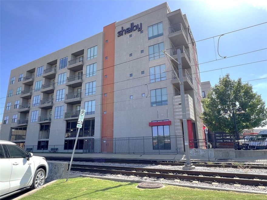 Well-maintained 2-bedroom, 2-bath condo just a short walk from SMU! This spacious unit features a split-bedroom layout for added privacy. The primary suite includes a large walk-in closet, ensuite bath, and beautiful city views. The open kitchen is perfect for entertaining and includes quartz countertops, microwave, refrigerator, and in-unit washer and dryer - all of which stay. Additional storage cabinets are included. The living area offers fantastic natural light and access to a private balcony with stunning city views. Condo has 2 assigned parking spaces. $40.00 water fee per month required in addition to rent. Only 1 small pet allowed with owner approval. Minimum 12 month lease term required by HOA.