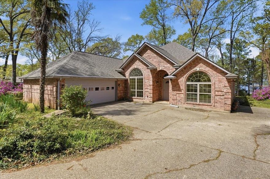Welcome to your private retreat on beautiful Lake Palestine, where comfort, craftsmanship, and nature come together in perfect harmony. This one-owner, custom-built 3 bedroom, 2 bath home is nestled within a gated, well-established community, offering both security and a true sense of tranquility.
From the moment you arrive, you’ll be captivated by the meticulously designed custom landscaping that enhances the home’s curb appeal and blends seamlessly with the natural surroundings. Step inside to discover a thoughtfully designed layout with spectacular lake views that maximizes both functionality and comfort, perfect for full-time living or a weekend escape.
Out back, the property truly shines. Enjoy peaceful mornings and breathtaking sunsets with stunning lake views, while an abundance of wildlife creates a serene, ever-changing backdrop. The private two-boat dock, complete with lifts, makes lake living effortless—whether you're heading out for a day on the water or simply relaxing by the shoreline.
This is more than just a home—it’s a lifestyle. Whether you're entertaining guests, enjoying quiet evenings by the water, or taking advantage of everything Lake Palestine has to offer, this property delivers a rare opportunity to own a slice of East Texas paradise.