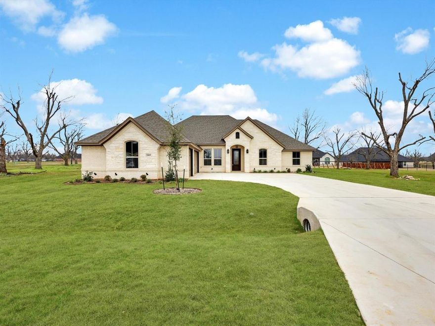 Welcome to this exceptional new build in the coveted, guarded community of Pecan Plantation’s Orchards neighborhood. Inside, an expansive living room features soaring coffered ceilings and a stunning floor-to-ceiling stone fireplace, opening seamlessly to the chef’s kitchen. The kitchen offers quartz countertops, an upgraded cooktop, a custom wood vent hood, under-cabinet lighting, a walk-in pantry, and an oversized island perfect for gathering. The eat-in dining area overlooks the backyard, while the private owner’s suite feels like a spa retreat with a large walk-in shower, free-standing soaking tub, dual vanities, and two walk-in closets with custom built-ins and seasonal rods. On the opposite side of the home are three generous bedrooms with sizable closets and a well-appointed hall bath. A versatile 5th bedroom makes an ideal office or guest space, and guests will appreciate the dedicated half bath. A spacious laundry room includes built-in cabinetry, extra storage, and a hanging rod. Step outside to the extended covered patio and enjoy the peaceful views the Orchards are known for. The 3-car garage offers epoxy flooring and plenty of space for vehicles, a golf cart, or storage. Thoughtful upgrades include wood-look tile flooring, crown molding, and energy-efficient spray foam insulation. Life in Pecan Plantation means resort-style amenities at your fingertips like golf courses, swimming pools, parks, tennis courts, horse trails, an airpark, archery, a clubhouse, and even your own grocery store. This is a home and a lifestyle you’ll love living every day!
