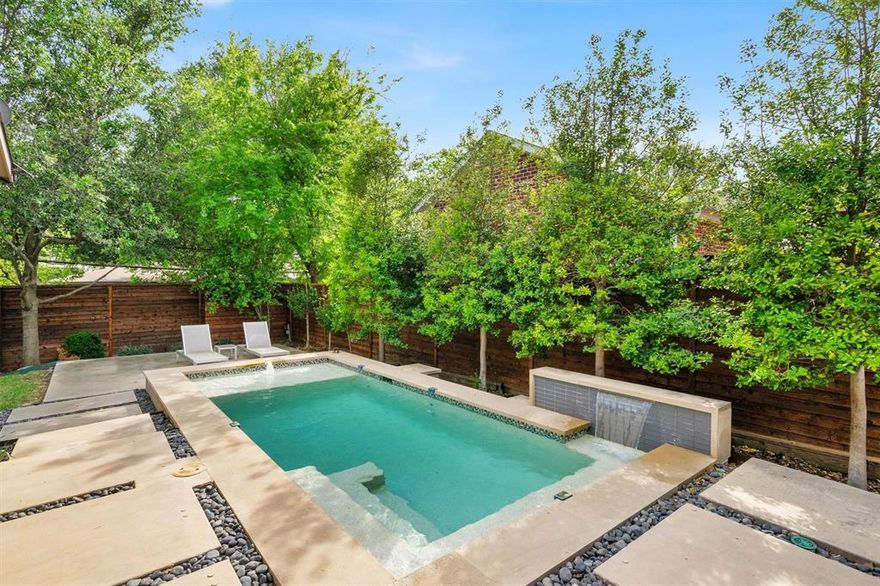 Rare opportunity to own a newer construction one-story home in Midway Hollow with a pool, yard space, and a highly sought-after floorplan. Designed with a clean, modern aesthetic and thoughtful layout, this home offers sophisticated style paired with comfortable everyday living.

The open-concept living spaces feature sleek finishes, abundant natural light, and seamless flow for entertaining. A striking glass wine room creates a stunning focal point, while the private office provides the perfect work-from-home space. The custom pantry adds both style and exceptional storage.

The spacious primary suite is a true retreat, featuring serene views and direct access to the pool and outdoor living area. Two additional private and spacious bedroom suites provide ideal accommodations for guests or family, offering comfort and privacy for all.

Outdoor living is equally impressive with a large covered patio overlooking the pool and yard — a rare combination in newer construction that provides both entertaining space and usable green space.

Additional features include solar panels, a water collection system, and smart home features, offering efficiency, convenience, and modern living.

Sophisticated, stylish, and move-in ready, this home offers the best of modern one-story living in one of Dallas’ most desirable neighborhoods, Midway Hollow.