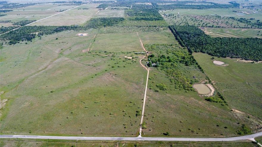 Nestled on a scenic 155 acres of Parker County open pasture and farmland, 2100 FM Rd 52 in Perrin, TX offers the perfect blend of rural tranquility and accessibility. This expansive property boasts easy all-weather access and is ideal for a cattle operation or residential development, with ample space to accommodate your agricultural or residential vision. The gently rolling terrain is perfect for grazing, while the location provides convenient access to Weatherford, Mineral Wells, and the Metroplex, making it a prime spot for anyone seeking both privacy and proximity to city amenities. With endless potential and a peaceful country setting, this property is a rare find for those looking to create their dream home or business in a thriving, yet quiet, part of North Texas.