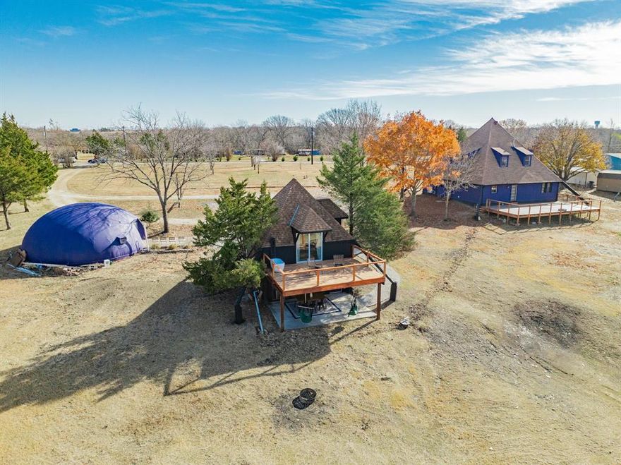 Rare 3.5-Acre Multi-Structure Estate on 2 LOTS with $4000+ Monthly Revenue Potential.

Discover an unmatched income-generating retreat or multi-generational compound across two distinct lots.

LOT 1 (1.5 Acres): The Architectural Main Residence
The centerpiece is a stunning 2,579 sq. ft. A-frame, completely renovated offering Bohemian Grandeur.
• Stats: 2 Bed, 2.5 Bath, Recent Roof and siding, Recent AC, & Water Heater.
• Features: Massive open-concept living, culinary kitchen with new appliances and an oversized primary suite. The new 800 sq. ft. deck offers tranquil views of the private woods and creek beyond.

LOT 2 (2 Acres): The Income Engine
Maximize your ROI with two additional structures designed for the high-demand STR (Short Term Rental) market.

• The Guest House: A fully functional 800 sq. ft. home (1 Bed, 1 Bath) currently generating $2,000per mo. in Airbnb revenue and featuring a kitchenette, downstairs living, and a private upstairs suite with a signature al fresco soaking tub.

• The Dome: A 720 sq. ft. air-conditioned dome style retreat, currently used as a studio. Add a bathroom to unlock an estimated additional $2,000 per mo. in potential STR income.

With flexible zoning potential and established revenue, this property is a partial turnkey solution for an owner-occupant looking to cover a part of investment with STR income, or an investor seeking a unique portfolio with growth potential.
