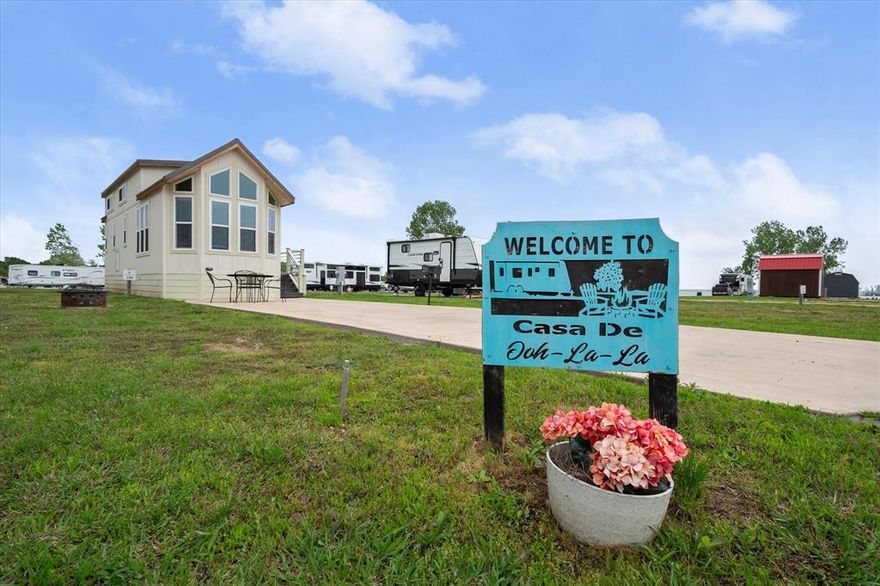 Located in the Peninsula Point Luxury Tiny Home and RV community on Richland Chambers Lake, this beautiful lot with a charming tiny home offers stunning lake views from both the front and back, creating the perfect setting for a tranquil retreat. The drive-through lot is ideally positioned on the peninsula and features a concrete pad already in place. Plus, with the tap fee already paid, the buyer enjoys significant savings. The tiny home is thoughtfully designed, featuring a primary bedroom with built-in storage and a double closet, plus two split sleeping lofts, maximizing comfort and functionality. The modern farmhouse-style kitchen includes a full-size refrigerator, glass cooktop, and microwave, making it as stylish as it is practical. Best of all, this home will be sold fully furnished and stocked, making it completely turnkey for either a personal getaway or a fantastic short-term rental investment. Enjoy the resort-style amenities of Peninsula Point, including a pool and outdoor clubhouse, gated and guard access, boat storage and ramp, laundry and grill facilities, and a park and pet walk area. This tiny home is rare as the park has filled all of the allowable tiny home spaces, so get this one while you can! Whether you're looking for a lakefront escape or an income-producing rental, this property is a rare opportunity