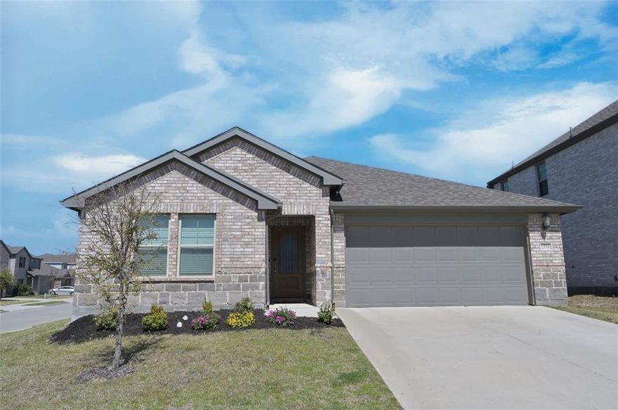 BEAUTIFUL, 4 BEDROOM, 2 BATH HOME on a premium corner lot in Cibolo Hills, where residents enjoy a resort style community with pool, parks, walking-jogging-bike trails and well maintained common areas! Zoned for Eagle Mountain-Saginaw ISD with two on-site schools, the New Eagle Mountain-Saginaw High, and an additional campus planned for the future. Built in 2021 with 2,059 sq ft of living space and an expansive open concept living area, perfect for entertaining, family and friends. The modern kitchen is a Chef's dream, featuring an abundance of cabinet and counter space, granite countertops, large seating Island, stainless steel appliances with 5 burner gas stove, tiled backsplash and walk-in pantry. Wood look Luxury vinyl flooring flows seamlessly throughout the hall, dining and main living areas. The split bedroom design enhances privacy, with the primary suite located at the rear of the home, offering an over sized shower, wide two sink vanity and huge walk-in closet. The front 4th Bedroom is a great optional Office or guest Bedroom. The deep 13 ft tiled laundry room offers additional space for a Freezer or folding table. Brick & stone front elevation with a nicely landscaped front. Large privacy fenced backyard, covered back patio, sprinkler system, gutters and more in this well established community! Short commute to the Alliance Town Center, Eagle Mountain Lake, Fossil Creek Golf Club and major highways with key employers in the Alliance corridor. Schedule a tour to see this lovely home today!