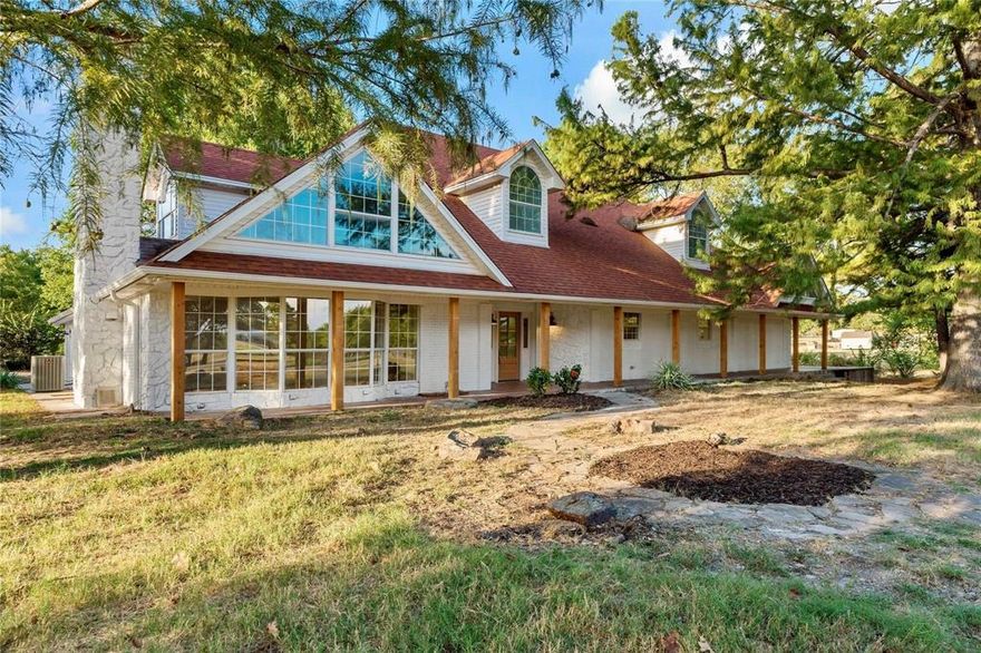 Beautifully updated 4-bedroom, 4-bath home for sale in NLISD on nearly 3 acres with country views and easy access to Paris, Texas and Oklahoma. This spacious property features an oversized kitchen, large open living room with fireplace, and a flexible floor plan perfect for multi-generational living, work-from-home, or guest quarters. The main level includes 3 bedrooms plus a dedicated office, while the upstairs offers an additional bedroom and bonus room ideal for a game room, media room, or second living space.
The primary bedroom suite is a true retreat with private pond views, an ensuite bathroom, a built-in coffee bar, and space for a sitting area or reading nook. Enjoy peaceful mornings on the private covered porch overlooking your pond, creating the perfect setting for coffee, sunsets, and quiet evenings.
Located in a desirable rural residential setting, this property offers privacy, acreage, and small-town Texas living while remaining close to shopping, schools, and highway access. With ample living space, modern updates, and a versatile layout, this home is ideal for families, hobby living, or those seeking room to spread out and enjoy the outdoors.