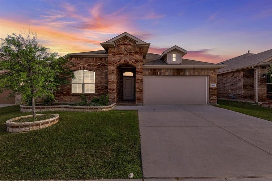 This thoughtfully designed home blends modern finishes with everyday functionality in all the right ways. From the moment you step inside, you’re greeted by a spacious, open-concept layout that feels both inviting and highly practical—perfect for entertaining, relaxing, or simply enjoying daily life. At the heart of the home is a beautifully appointed kitchen that checks every box. Featuring a gas cooktop and oven, expansive cabinetry, sleek granite countertops, and a large center island, this space flows seamlessly into the living area, making it ideal for gatherings or keeping everyone connected. Whether you're hosting or cooking a quiet dinner at home, this kitchen delivers both style and performance.  The common areas are enhanced with durable and stylish wood-look tile flooring, offering the warmth of hardwood with the ease of maintenance—perfect for busy households. The open layout maximizes both space and natural light, creating a bright and welcoming atmosphere throughout.  Convenience continues with a generously sized laundry and utility room, providing ample space for storage and organization—something you’ll appreciate every day.  Step outside and enjoy a location that’s hard to beat. Situated just a block from the elementary school and a nearby community park, daily routines become easier and more enjoyable. The neighborhood also offers exceptional amenities, including a community pool complete with a relaxing lazy river—perfect for cooling off during those warm Texas summers. Energy efficiency is another standout feature, with solar panels already installed to help provide more predictable and potentially lower energy costs—an increasingly valuable benefit.  This home's modern construction, functional design, terrific value, and desirable community features offers the complete package for comfortable, connected living.