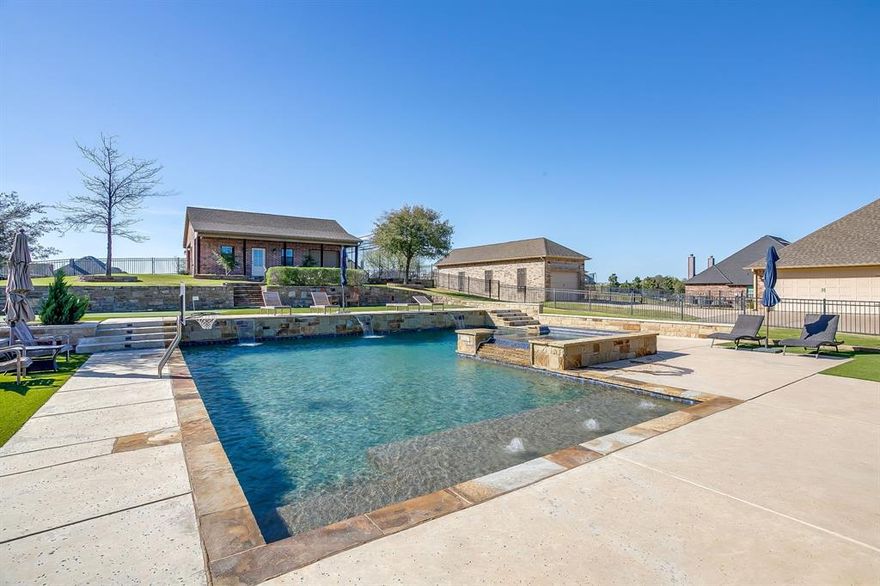 Discover luxury living at its finest in this stunning home located in Bella Ranch. Nestled in a desirable neighborhood within Aledo ISD, this exceptional property combines elegant design, modern comfort, and an outdoor oasis that truly sets it apart.

Step inside to find a beautifully appointed interior featuring spacious living areas, high ceilings, and abundant natural light. The open-concept layout flows effortlessly, making it perfect for both everyday living and entertaining. A gourmet kitchen anchors the home with stylish finishes, ample cabinetry, and generous counter space, ideal for hosting gatherings or enjoying quiet nights in.

The true showstopper lies just beyond the back doors—your own private resort-style retreat. The backyard is designed for relaxation and entertainment, boasting a spectacular resort-style pool that invites you to unwind in luxury. Whether you're lounging poolside, hosting summer barbecues, or enjoying peaceful evenings under the stars, this outdoor space offers the perfect escape. Lush landscaping and thoughtfully designed living areas create a sense of privacy and serenity that feels like a vacation every day.  Relax in the oversized pool or remain active with an inground trampoline, putting green, or 55' batting cage with maintenance free turf and lights.

The home’s spacious bedrooms provide comfort and flexibility, while the primary suite offers a private sanctuary with a spa-inspired atmosphere. Every detail throughout the home has been carefully curated to blend style and functionality.

Located in a sought-after area of Fort Worth with convenient access to shopping, dining, and top-rated schools, this property delivers both elegance and lifestyle.

This is more than a home—it’s a retreat. Don’t miss the opportunity to make it yours.