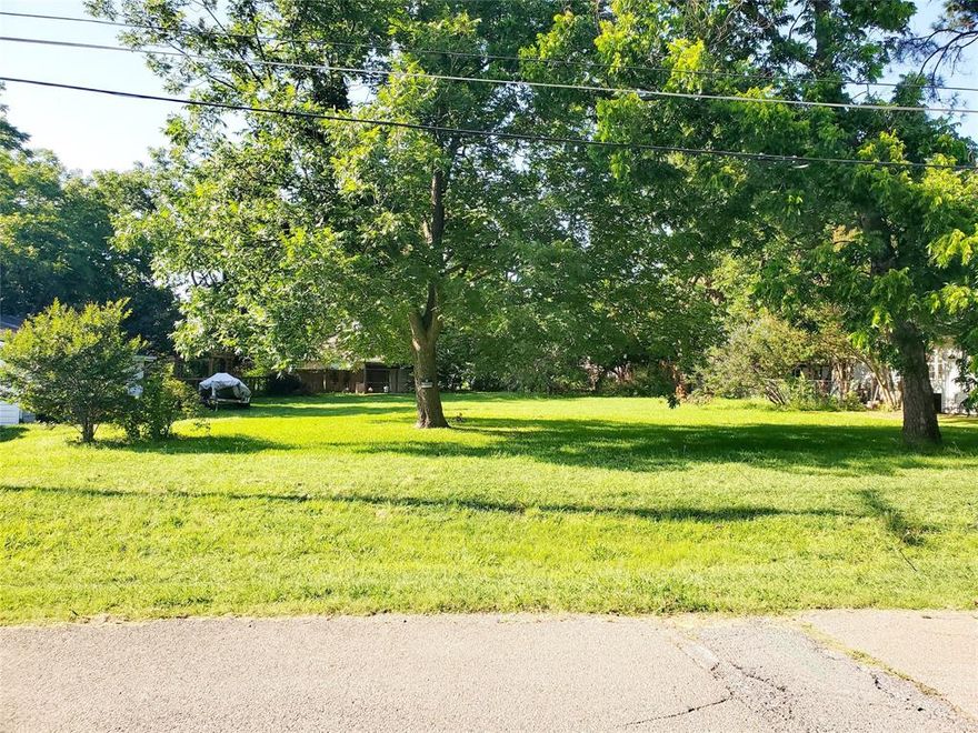 Pretty interior residential lot ready for a site-built home. Has some trees and lot has 50 feet of street frontage. All information is deemed reliable but not guaranteed. Buyer and buyer's agent should verify all information, including schools, zoning, taxes, utilities.