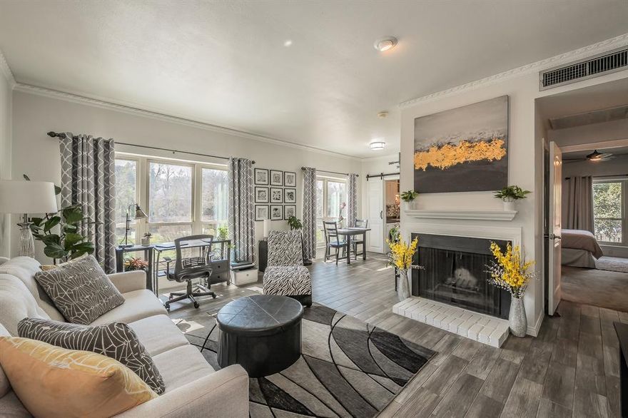 Experience elevated living in this beautifully maintained condo offering breathtaking views of the Trinity River and an unbeatable location in the heart of Fort Worth and minutes from TCU. Natural light fills the open-concept living and dining areas, creating a warm, inviting atmosphere perfect for both relaxing evenings and entertaining guests. Large, updated windows frame stunning river views while enhancing energy efficiency and comfort. The thoughtfully designed kitchen features ample cabinetry, generous counter space, and a functional layout that flows seamlessly into the main living area. The spacious primary suite offers comfort and privacy and showcases a beautiful custom accent wall, along with two large walk-in closets providing exceptional storage and organization. Assigned covered parking is conveniently located just steps from the stairs leading to the private patio, making everyday living easy and accessible. Residents appreciate secure access, well-kept common areas, and the peace of mind of living within a gated community, all while enjoying the convenience of low-maintenance living. Step outside and enjoy a short walk to the scenic Trinity Trails, nearby parks, and endless opportunities for outdoor recreation. The property is also within walking distance to Tanglewood Elementary, as well as popular grocery stores and a wide variety of local restaurants, making this an ideal blend of comfort, style, and prime location.