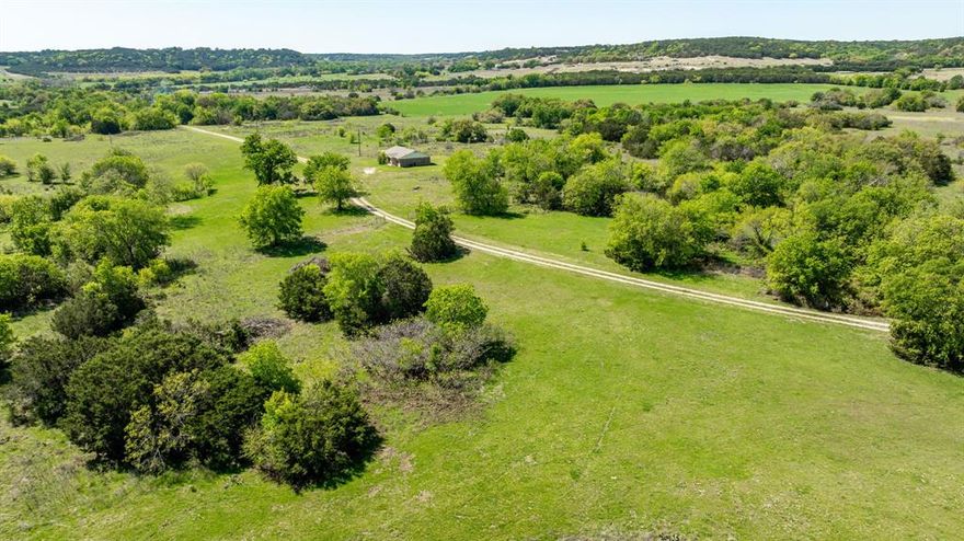 Discover 191 acres in Bosque County, just minutes from Meridian, Texas, with convenient access to Highway 6, making trips to Hico, Stephenville, and Waco a breeze. This versatile property offers endless opportunities, whether you are looking for a full-time residence, weekend ranch, or recreational getaway. The land features a charming 3-bedroom, 1-bathroom brick home, ideal for country living. The seller has thoughtfully cleared portions of the property and recently added a new stock tank, bringing the total to two tanks, in addition to a seasonal creek that enhances the natural beauty and utility of the land. A mix of open pasture, native grasses, and mature hardwoods provides a balanced landscape perfect for grazing, hunting, or exploring. The property currently supports cattle and carries an agricultural valuation. A nostalgic barn adds character and is ready for storage or transformed into a modern structure with historic charm. Call us today to schedule an appointment to see this Texas Ranch!