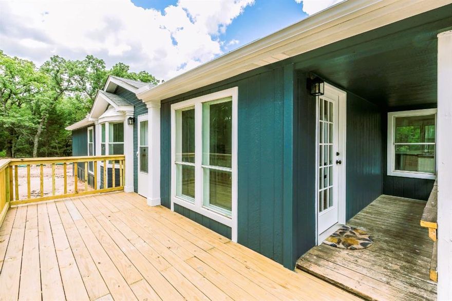 Nestled on a gorgeous wooded lot with its own private well and septic system, this beautifully updated home offers peace, privacy, and self-sufficiency.

Step outside and enjoy multiple outdoor living spaces, including a spacious front deck, a side deck, and a covered back deck—perfect for relaxing mornings or hosting guests. A convenient carport and rain gutters add extra protection and functionality.

Inside, the cozy living room is anchored by an ornate wood-burning fireplace with a blower, providing both warmth and timeless charm. The kitchen is designed for both function and gatherings, featuring abundant counter space, ample storage, microwave, range, dishwasher, and a large island.

The spacious bedrooms offer plenty of natural light and closet space, while the primary suite features a beautifully appointed bathroom with dual sinks and a walk-in shower.

Additional highlights include:

Decorative lighting, ceiling fans, Skylights for added natural light, dedicated laundry room with washer & dryer connections, extra storage throughout and No HOA!

Blending comfort, style, and practicality in a serene setting, this home is truly move-in ready. Don’t miss your chance to make it yours—schedule a private showing today!

VA and Conventional loans welcome! 

All information is deemed reliable, and the buyer and buyer’s agent are responsible for verifying all information, including but not limited to the status of construction of the home, lot dimensions, easements, school district, and subdivision restrictions. It is the responsibility of the buyer(s) and the buyer(s) agent to verify the status of completion prior to scheduling site inspections. Some pictures may have edited.