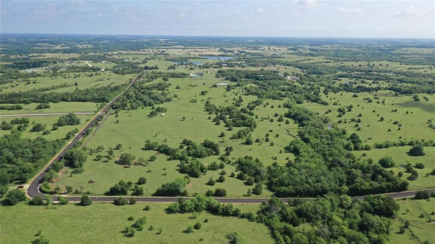 Located in the scenic Collin County, this magnificent 11+ acres parcel of land offers an idyllic setting for creating your very own oasis.  Nestled in the northeast region of the county, this property boasts picturesque rolling terrain and is situated just outside the city limits, ensuring tranquility and privacy.  The land is adorned with a variety of trees & pond enhancing its natural beauty and providing shade and serenity.  With breathtaking sunsets gracing the horizon, this enchanting property offers the perfect backdrop for your dream home.  Whether you aspire to construct a custom residence or design a retreat that embraces the surrounding natural wonders, this land presents an exceptional opportunity to craft a haven tailored to your desires.