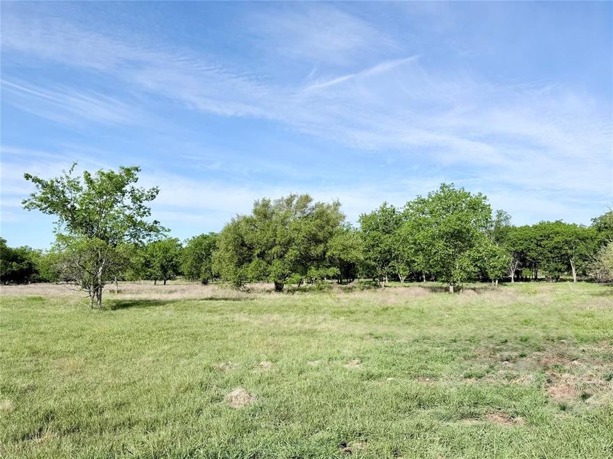 This 3.10-acre lot within the city limits of Whitney features a balance of large mature trees and open build space. Located in the gated Lakewood Acres subdivision with City water, underground electric, and a chip sealed private road. Deed restrictions align with City of Whitney rules. Enjoy space, privacy, and wildlife in a centrally located community.