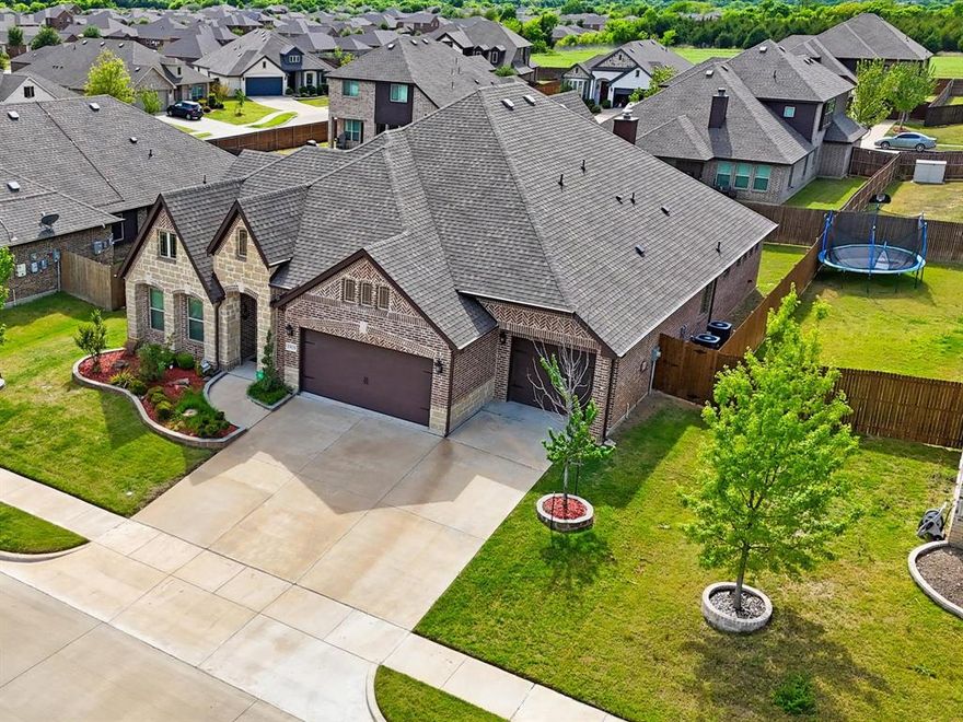 Step into timeless elegance with this stunning Primrose floor plan by Bloomfield Homes—designed to impress from the moment you arrive. A striking rotunda entry welcomes you in and sets the tone for the thoughtful design and architectural charm found throughout the home.
Featuring 3 spacious bedrooms, 2.5 baths, a private study, and two dining areas, this layout offers both functionality and flexibility for everyday living and entertaining. The heart of the home is the breathtaking family room, highlighted by a soaring 17-foot ceiling and a dramatic ledgestone fireplace with a cedar mantel—creating the perfect gathering space. The deluxe kitchen is a true showstopper, complete with built-in stainless steel appliances,  cooktop, wood vent hood, pot and pan drawers, and upgraded finishes throughout. Granite countertops in both the kitchen and primary bath add a touch of luxury, while large windows flood the home with natural light.
You’ll find thoughtful details at every turn—charming window seats, elegant archways, art niches, mudroom cabinetry, and glass French doors leading into the study. Upgraded large-format tile flows seamlessly through the main living areas, enhancing both style and durability.
With three garage spaces offering a total of three covered parking spaces and room to grow, this home is ready to meet your needs now and into the future. A custom 8-foot front door adds the perfect finishing touch to this beautifully crafted home—ready for you to make it your own.