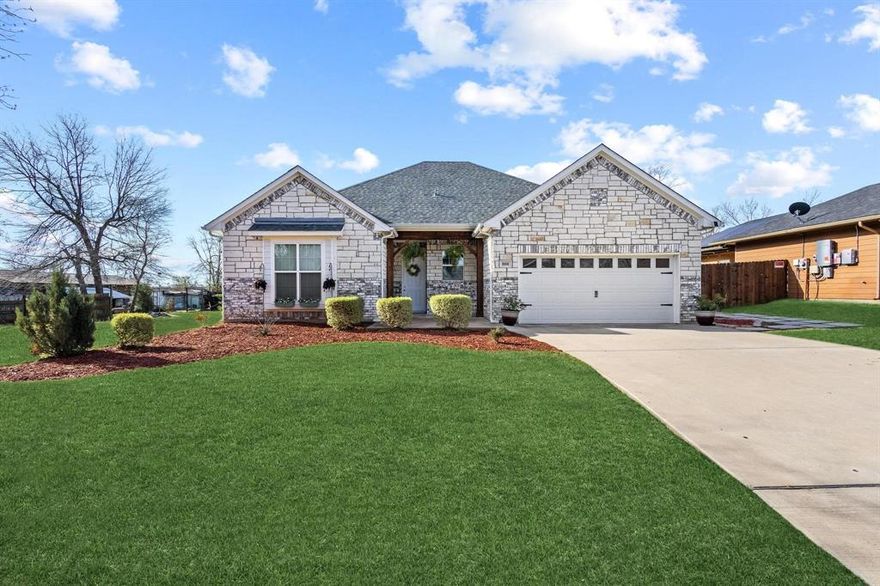 Stanford Luxury Homes with all the favorite upgrades. Open floorplan features tall ceilings, elegant color scheme, rich flooring, crown molding, pass thru kitchen. Beautiful quartz countertops, stainless appliances, custom soft-close tall cabinetry, remote lighting controls & custom ceiling fans. Eat in kitchen as well as bar seating.  Primary bedroom has a window seat, room for sitting area and  you will enjoy the fabulous master bath with your dream closet, double vanity, separate shower and soaking tub. A spacious bathroom you can enjoy without knocking elbows at the sink.  Head outdoors to a flat almost .20 acre backyard. The peaceful backyard offers room to grow—perfect for entertaining, relaxing, or future outdoor plans. Privacy is provided with the custom cedar privacy fence. Lifetime architectural shingles, spray foam insulation, heat & low-e windows ensure energy efficiency & low-to-no maintenance for years. Tall & wide garage has workbench space & insulated allowing many options for use or flex space.  A move-in-ready home that blends style, comfort, and smart value. This property offers tranquility and peacefulness from the city bustle. Easy access to Hwy 82, Hwy 121, and I-75. Close to Bonham Hospital, shopping, restaurants, schools, and an hour drive to DFW airport. Located close to McKinney, Greenville, and Sherman. You will also enjoy the close proximity to the new Bois D’Arc Lake. Home and location is a value priced option and plentiful upgrades.