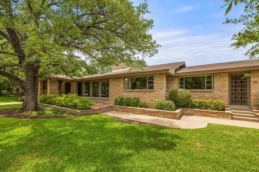 Welcome to 2900 Simondale Drive - an architectural treasure perched on the bluff side in one of Fort Worth's most prestigious neighborhoods.  Just steps from the legendary Colonial Country Club, this iconic mid-century modern home sits gracefully on 1.67 acres of lush, park-like grounds beneath a canopy of mature trees and offers a harmonious blend of privacy and prestige.  Wrapped in elegant stacked stone, this residence blends seamlessly with its natural surroundings.  Inside and out, this property offers exceptional privacy and the potential for gorgeous views over the bluff.  Whether you're drawn to the quiet elegance of classic design or envision enhancing the home to capture its full potential, this is a rare opportunity to own a piece of architectural history in an unparalleled setting.  Discerning buyers will appreciate the pedigree of design, the exclusivity of the location, and the unrivaled potential of this estate-sized property.  This is not just a home - it's a legacy in the making.