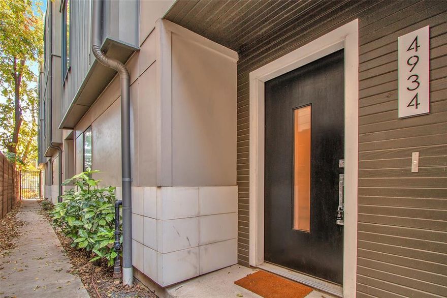 Located in the highly desirable East Village area of Dallas, this stunning modern townhome offers the perfect combination of style, functionality, and walkable urban living. Built in 2017, the home features approximately 2,092 square feet with 3 spacious bedrooms and 3.5 bathrooms, with each bedroom offering its own private ensuite bath for ultimate comfort and privacy. The open concept design is ideal for entertaining, highlighted by hardwood floors throughout and a beautifully appointed kitchen featuring waterfall quartz countertops, Bosch appliances, solid-core doors, and an oversized island. The home includes numerous thoughtful upgrades such as touch-sensitive kitchen faucets, tankless water heater, smart home features, and modern lighting fixtures. The elevated third-floor living area offers tall ceilings, abundant natural light, and surround sound, creating an impressive entertaining space. Step outside to the rooftop patio complete with outdoor fire pit and string lighting—perfect for relaxing evenings or hosting friends while enjoying views of the Dallas skyline. Additional features include an attached two-car garage and a low-maintenance lock-and-leave lifestyle with no HOA. Ideally located within walking distance to the shops, restaurants, and nightlife along Henderson Avenue and just minutes from Downtown Dallas, Uptown, and Lower Greenville, this home offers exceptional convenience and urban living at its best.