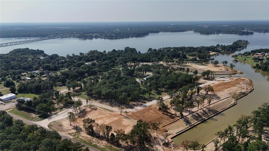 Welcome to Emerald Bay at Cedar Creek Lake! Where luxury meets natural serenity, a remarkable community featuring only 71 exclusive homesites meticulously crafted across 44 stunning acres. Here, you can choose from both waterfront and interior homesite options, making it your chance to call this exceptional subdivision home—just over 1 hour east of downtown Dallas. Immerse yourself in a naturally inspired lake lifestyle at Emerald Bay, where your amenities embody the perfect intersection of nature and luxury. Life at Emerald Bay revolves around the refreshing waters of Cedar Creek Lake. LOT #10 ON 91' LF SHORELINE  WATERFRONT.  INQUIRE ABOUT SELLERS CONCESSION!

Amenities at Emerald Bay:
- Stunning Swimming Pool: Designed for leisure, the pool is perfect for swimming laps or lounging poolside, offering a peaceful retreat.
- Pickleball Courts: Stay active on our state-of-the-art pickleball courts.
- Basketball Courts: Shooting hoops at our well-maintained basketball courts.
- Playground: Designed for family fun and adventure. 
- Fire Pit: Enjoy cozy evenings around the fire pit, perfect for cooler nights while surrounded by the beauty of nature.
- Golf Cart Trails: Scenic golf cart paths throughout Emerald Bay, to navigate the community and connect with neighbors. 

This gated community boasts concrete roads, curb and gutter, underground utilities, street lighting, private water, private sewer, and fiber optic connections. With deed restrictions and architectural guidelines for builders, Emerald Bay is a roadmap to a luxurious lifestyle, offering both elegance and comfort. Emerald Bay is not only a stunning community but also conveniently located just a 10-minute drive away from the prestigious Pinnacle Golf Club. This 18-hole championship golf course has been voted the 8th best in Texas, making it a premier destination for golf enthusiasts.  
Being so close to Pinnacle Golf Club adds an exceptional layer to the Emerald Bay lifestyle.