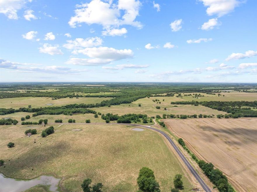 This stunning 484-acre ranch in Lake Creek, TX, consists of sprawling pasture, 7 ponds and the expansive meandering creek known as Lake Creek. The creek serves as a natural boundary within the property separating a large area of grazing and hay production and dense brush filled hunting landscape. The expansive front pasture provides ample space for livestock to roam or your new home. Located approximately 15 miles from Cooper Lake State Park and 35 miles from the new Lake Ralph Hall, this property offers an idyllic setting for many purposes.  Lake Creek is an unincorporated community in Delta County, Texas located southeast of the county seat, Cooper, TX.  If you're looking for a quiet estate in a rural setting surrounded by farming and ranching this, is the one. Property is fenced