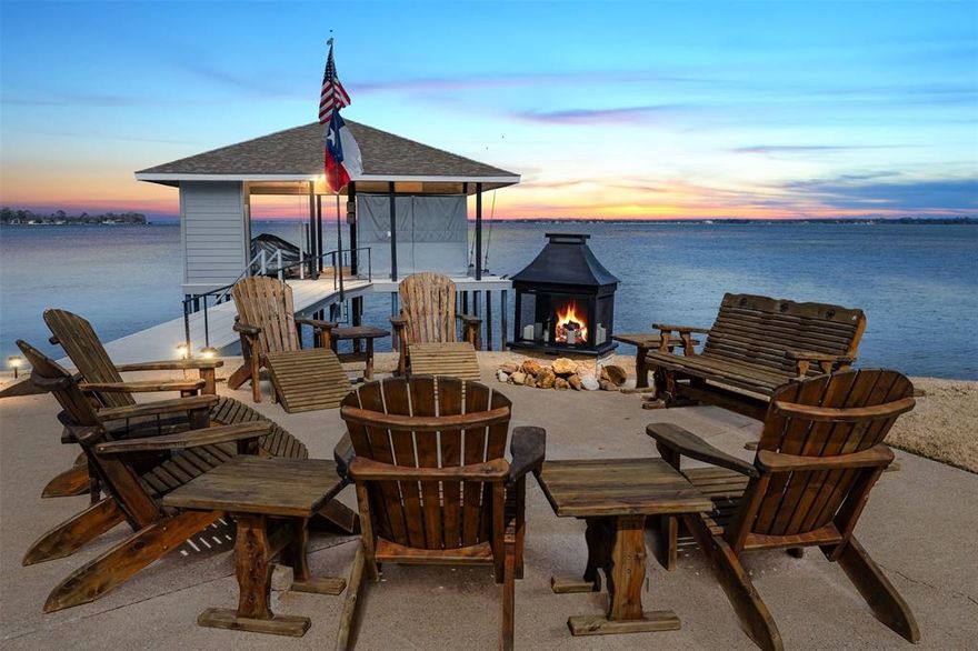 MOTIVATED SELLER, MAJOR PRICE REDUCTION! Rare peninsula point in prestigious, gated Beachwood Estates on Cedar Creek Lake, offering 173’ of shoreline and sweeping 270° deep, open water views, an exceptional, hard-to-find setting with incredible privacy and panoramic vistas. This architecturally unique, ship-inspired home features porthole windows, custom angles, and a dramatic octagonal, glass-walled living area that fills the space with natural light and showcases the view. The open-concept interior is designed for entertaining and includes luxury vinyl plank flooring, new carpet, granite countertops, KitchenAid stainless appliances, LED lighting, and smart home features with remote drop-down TV. The main-level primary suite offers lake views, en-suite bath with dual sinks, jetted tub, separate shower, and walk-in closet. Upstairs are two guest bedrooms, a 3rd full bath, and flexible second living area. A 'hidden staircase' leads to the crow’s nest with spectacular 360° views for miles. Enjoy outdoor living with large waterside patio and 2021 composite dock with boat lift, dual PWC lifts, and remote cover. Additional features include 2023 retaining wall, full irrigation with lake pump, security system, and 3-car garage with 220V. This is a rare opportunity to own a one-of-a-kind peninsula property with expansive water views. Whether as a full-time residence or weekend escape, this home delivers luxury, character, and unbeatable value. Just about an hour from downtown Dallas, come experience lake life at its finest!
