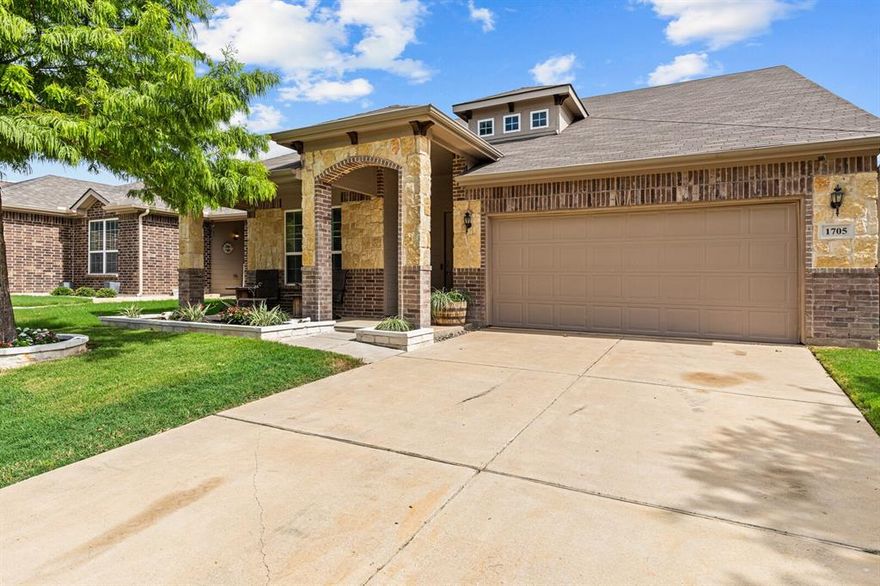 Set within the sought-after Quail Springs community, this thoughtfully designed 3-bedroom, 3-bath home features a flexible floor plan, generous space, and timeless comfort. Soaring 12-foot ceilings and abundant natural light create an inviting atmosphere from the moment you step inside, while the open layout is equally suited for everyday living and entertaining. The main level includes a private primary suite tucked into its own corner of the home, along with a second bedroom and a dedicated office—ideal for guests, remote work, or multi-generational needs. Upstairs, a spacious third bedroom is paired with a large second living area or flex space, perfect for a media room, game room, or quiet retreat. The open-concept kitchen showcases dark cabinetry, ample counter space, a center island, and modern appliances, flowing seamlessly into the breakfast nook and living area anchored by a cozy wood-burning fireplace. Out back, enjoy a covered patio overlooking a generously sized yard with room to relax, play, or entertain. Additional highlights include a roof replaced in 2021, a two-car garage, and a prime location just minutes from dining, shopping, and everyday conveniences.