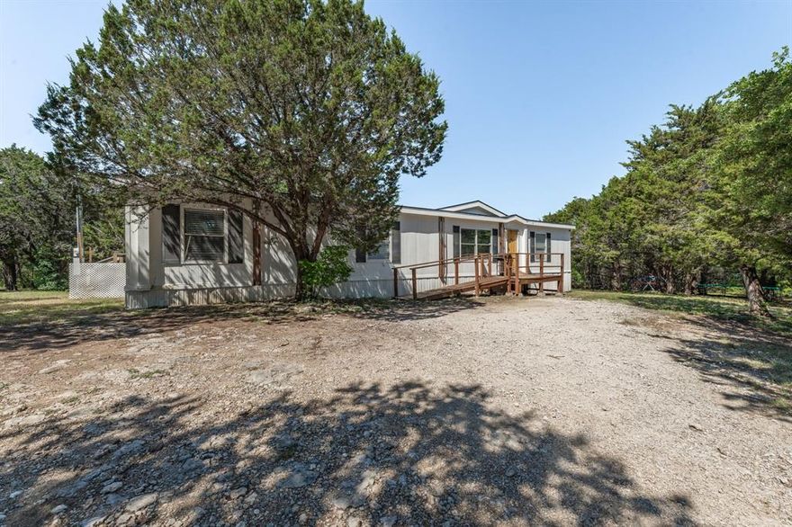 This one is a very nice mobile home located on an oversized lot!! This home has a ton of room, the rooms are all very good sized! It features 4 bedrooms, 3 full baths and an open living, kitchen and dining room area! This home is move in ready and priced to sell! The lot is oversized and has a lot of room to run around and enjoy it! Its located towards the end of a quiet Cul de sac street. If you are looking for a home that will not break the bank, then come take a look at this one as see if its the one for you!! The HOA community has a boat ramp, community dock and pool that included with the required membership!