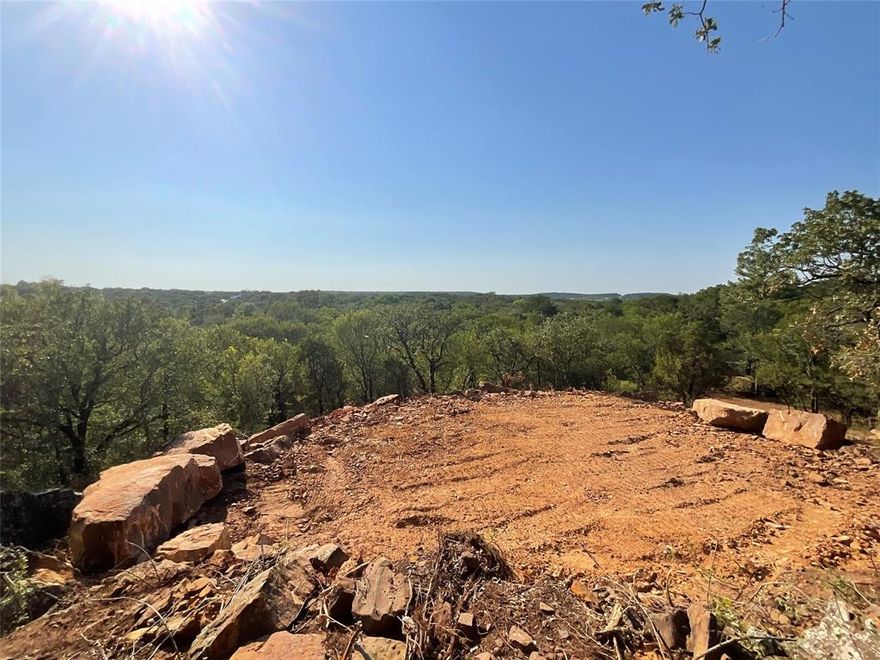 **Owner Financing Available** Be the King of your own hill! Beautiful hilltop lot with great views! Come see what Mineral Wells has to offer and build your new home here!  This lot has tons of trees, so you can carve out a place to build and maintain privacy.