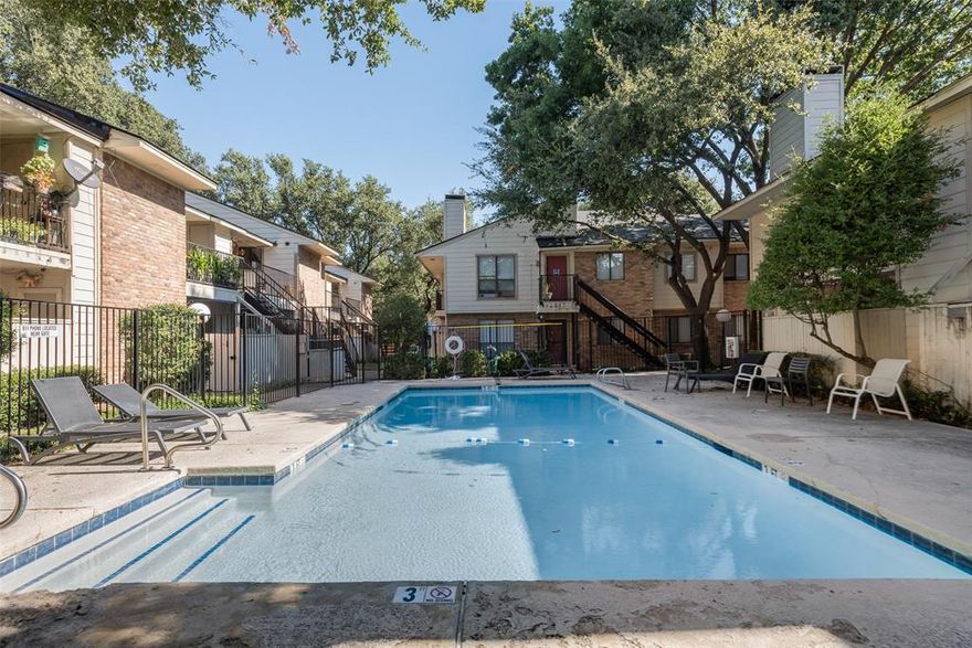 Welcome to this well maintained gem in the gated Oaks on the Lane community that is centrally located just minutes from SMU's campus. This gorgeously updated unit with an open concept floor plan includes one spacious Master bedroom that features an ensuite renovated bathroom and a great size walk-in closet. The galley kitchen is equipped with all black appliances, quartz counter tops and has plenty of cabinet storage. It flows seamlessly into the dining and living area, creating an open and inviting space. The bright living room boasts a vaulted ceiling, skylight, and a cozy fireplace. Vinyl flooring throughout adds ease and style. Enjoy the tranquil atmosphere the private balcony has to offer. Amenities include two community pools and one assigned carport space. New roof is being installed throughout the condominium. Convenient location close to major highways in a friendly neighborhood with easy access to shopping centers, parks, and schools, blending urban convenience with sanctuary living. Ideal for first-time buyers, professionals, down-sizers or investors.