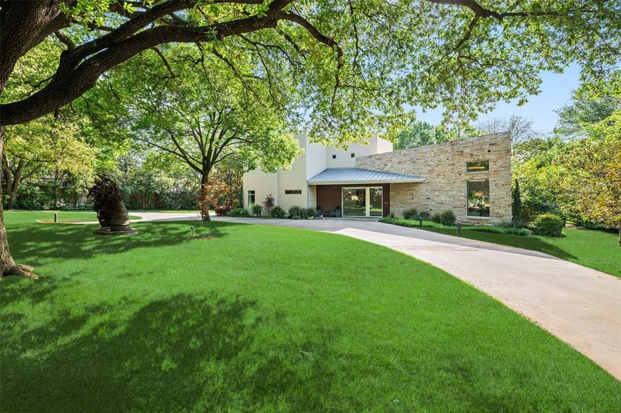 Tucked beneath mature trees on just under an acre, this fully reimagined modern estate offers exceptional privacy and design. The property features over 7,000 square feet of air-conditioned living space and garage capacity for seven vehicles, all climate-controlled and seamlessly integrated into the home. Expansive living areas showcase soaring ceilings and generous wall space ideal for art collections. Additional highlights include a glass-enclosed wine room, media room, and oversized entertaining spaces. The primary suite offers a private retreat with a spa-inspired bathroom. Meticulously updated with contemporary finishes throughout, the home balances architectural integrity with modern comfort. Lush landscaping surrounds the residence, creating a private sanctuary ideal for luxury living and entertaining.