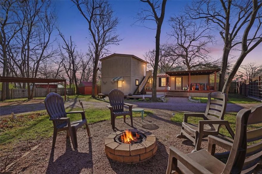 Just minutes from the shores of Lake Texoma, 48 Ivanhoe in Gordonville offers the perfect blend of charm, functionality, & investment potential. Whether you're searching for a relaxing weekend lake retreat, full-time residence, or short-term rental on Lake Texoma, this property delivers comfort & versatility in a peaceful setting. This well-maintained 2-bed, 1-bath manufactured home comes furnished & has been thoughtfully updated & offers a warm inviting feel the moment you arrive. The home sits on a spacious lot designed for relaxation and productivity, making it ideal for those who enjoy outdoor living, gardening, or simply unwinding after a day at the lake. Outside, the property truly shines with a variety of improvements that add both function & character. A large 2 car carport provides parking and protection from the elements. For those with a green thumb, the greenhouse and dedicated gardening shed create the perfect setup to grow flowers, herbs, or vegetables year-round. A unique two-story 16x15 accessory building offers incredible flexibility and could easily serve as a workshop, hobby space, studio, or private office. The covered steel patio is built to last, offering a durable outdoor entertaining space that won’t warp or weather over time. It’s the perfect place to enjoy your morning coffee, host friends after a day on the water, or relax in the evening shade. Just steps away, a cozy fire pit area invites gatherings under the stars and adds to the laid-back lake lifestyle this property embodies. The yard is fully fenced creating a secluded atmosphere ideal for quiet relaxation, pets, or weekend get-togethers. The property has been well cared for, giving buyers confidence in both the home and the improvements already in place. With Lake Texoma just minutes away and plenty of space to enjoy both indoors and out, 48 Ivanhoe presents a fantastic opportunity to own an affordable and versatile property in one of North Texas’ most popular lake communities.