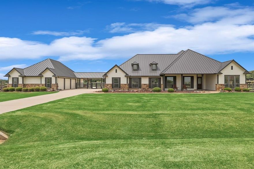 This STUNNING property is unlike anything you've seen! As you enter the front door your eye is drawn out the massive windows in the living room that look out over beautiful pasture. If you look up you'll see the entry has wedding cake crown, simply stunning! The flooring throughout is wire brushed white oak and limestone tile. That same wood makes up the coffered ceiling in the dining room. To the rt, you have 2 bedrooms connected by a jack & jill bathroom with a custom limestone bath. The kitchen has double islands with quartz countertops. The fridge is built in & will convey. The windows in the living are new. Custom walnut built in tv cabinet. Huge upstairs room w balcony has new carpet & fully decked attic. The custom utility room has 2 double stacks of w-d that convey. 2 more bedrooms that connect w a hidden door and a bath. Pool, outdoor living and outdoor kitchen put in 2 yr ago. 2250 sf travertine! Casita was fully remodeled w bath & kitchen is perfect for office or apartment.