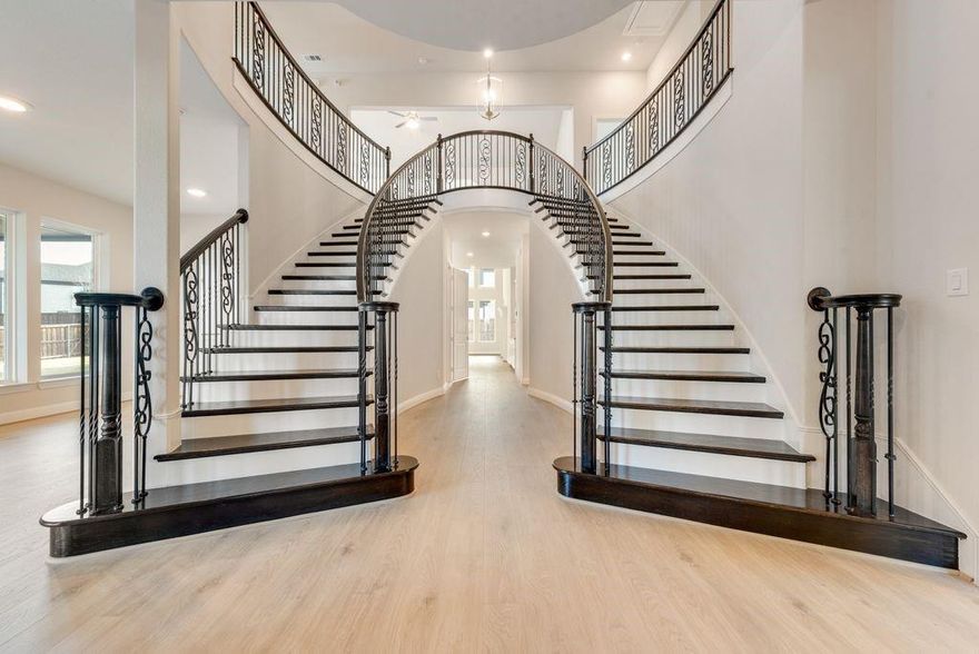 Stunning New Grand Home in South Pointe. This beautifully designed Grand Home is JUST COMPLETED, Mansfield’s premier master-planned community. Perfectly positioned on a spacious 0.25-acre lot with a 3-car port cochere garage, this home blends elegance, comfort, and thoughtful design in one of the area’s most desirable neighborhoods. Enjoy resort-style amenities including a pool, parks, greenbelts, scenic trails, and a state-of-the-art amenity center—all within top-rated Mansfield ISD.
Step inside to an open-concept layout that’s ideal for everyday living and entertaining. A soaring, vaulted family room connects to a large, covered patio—perfect for gatherings. The double staircase with wrought iron balusters adds architectural charm, while 8' interior doors and stylish lever hardware elevate the interior.
This amazing home has TWO kitchens.  The main kitchen features Shaker cabinetry, granite slab countertops, a commercial style range with double ovens and a commercial vent hood, stainless steel appliances, and a full-bowl sink. The Prep Kitchen or Catering kitchen is spacious with oven, cooktop, dishwasher, full sink & space for fridge with lots of storage.
 A formal living area offers flexibility as a home office or den, a Formal Dining is off the main kitchen and a guest suite on the main level ensures privacy and convenience.
The primary suite is a private retreat with a freestanding tub, dual vanities, and a frameless glass shower. While upstairs, a spacious game room and a media room that is pre-wired for surround sound, offer additional space to relax and unwind. The laundry room is outfitted with double washer and dryer connections
Walk to area schools, with a new on-site campus planned soon. Built by an Energy Star Partner with R38 insulation, this home includes full builder warranties for peace of mind.