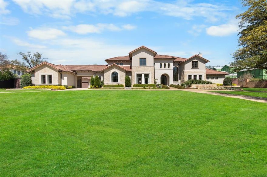 Architectural Residence - Preston Hollow Estate Corridor.  
Situated on a quiet cul-de-sac in Preston Hollow’s prestigious estate corridor, this exceptional residence offers a rare combination of scale, craftsmanship, and resort-style amenities. Designed by renowned David Viosca and built by Zachary Custom Homes, the home spans 10,786 square feet on a 1.176-acre lot, reflecting a modern transitional style with Santa Barbara influences.
From the moment you arrive, the home is defined by its timeless architecture, tile roof, and quiet sophistication. Inside, soaring ceilings and expansive living areas create a refined yet comfortable atmosphere, with seamless indoor-outdoor flow ideal for both everyday living and entertaining.
The home features 5 bedrooms, 6 full baths, and 2 half baths, anchored by a spacious primary suite with a spa-inspired bath and steam shower. The great room showcases a dramatic wall of windows, filling the home with natural light and creating a seamless connection to the outdoor living areas. A private executive office, dedicated kids’ study-resource room, and private gym provide functional spaces for work, wellness, and everyday living.
Designed for both leisure and entertainment, the home includes a media room, golf simulator, and a 700-bottle wine room. A Control4 system provides whole-home automation of lighting, sound, and essential systems.
Outdoor living is equally impressive, with a resort-style pool, full-size tennis court, and a thoughtfully designed backyard featuring a combination of natural grass and turf for year-round usability. A fully equipped outdoor entertainment pavilion provides the ideal setting for hosting and relaxing, while two outdoor fireplaces create inviting gathering areas, complemented by two indoor fireplaces that add warmth and character inside.
Additional highlights include a 4-car garage with epoxy flooring and built-in cabinetry, offering both functionality and a clean, finished look.