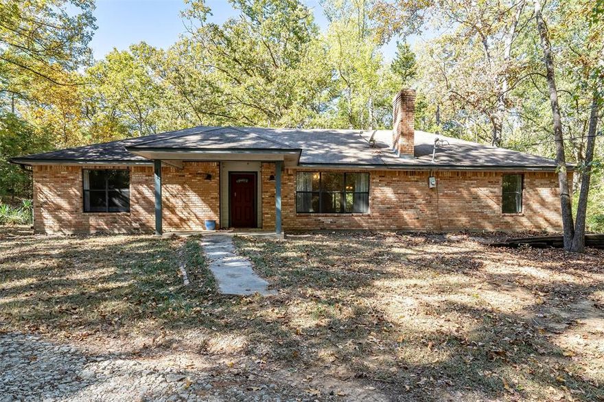 Tucked away among the pine trees of East Texas, this peaceful ranch-style home sits on almost 10 acres of serene, wooded countryside. The 3-bed, 2-bath home is full of potential for your personal touch. Inside, you’ll find two versatile living areas, both with a fireplace—perfect for a game room or family space—plus a dining area with a large butler’s pantry and extra storage. Outside, a handy shed keeps yard tools organized, and a Timber Exemption offers tax benefits. Discover comfort, privacy, and the simple beauty of country living. There has been wildlife such as deer seen on the property. There are no known resrictions. Refridgerator and microwave are included with property. $10,000.00 in consessions for updates or to use towards closing costs with full price offer.